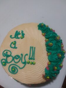 A gender reveal cake for a boy