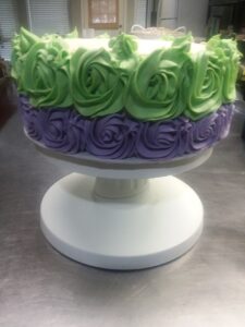 A two-layered green and purple cake