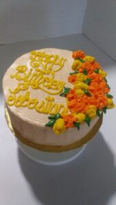 A birthday cake with flower décor