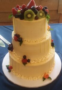 A three-tiered cake with berries