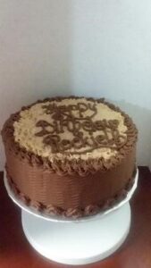 A single-layered chocolate birthday cake